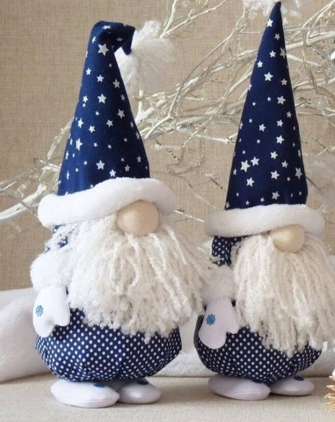 Two elves in blue hat and with white beards, round noses.